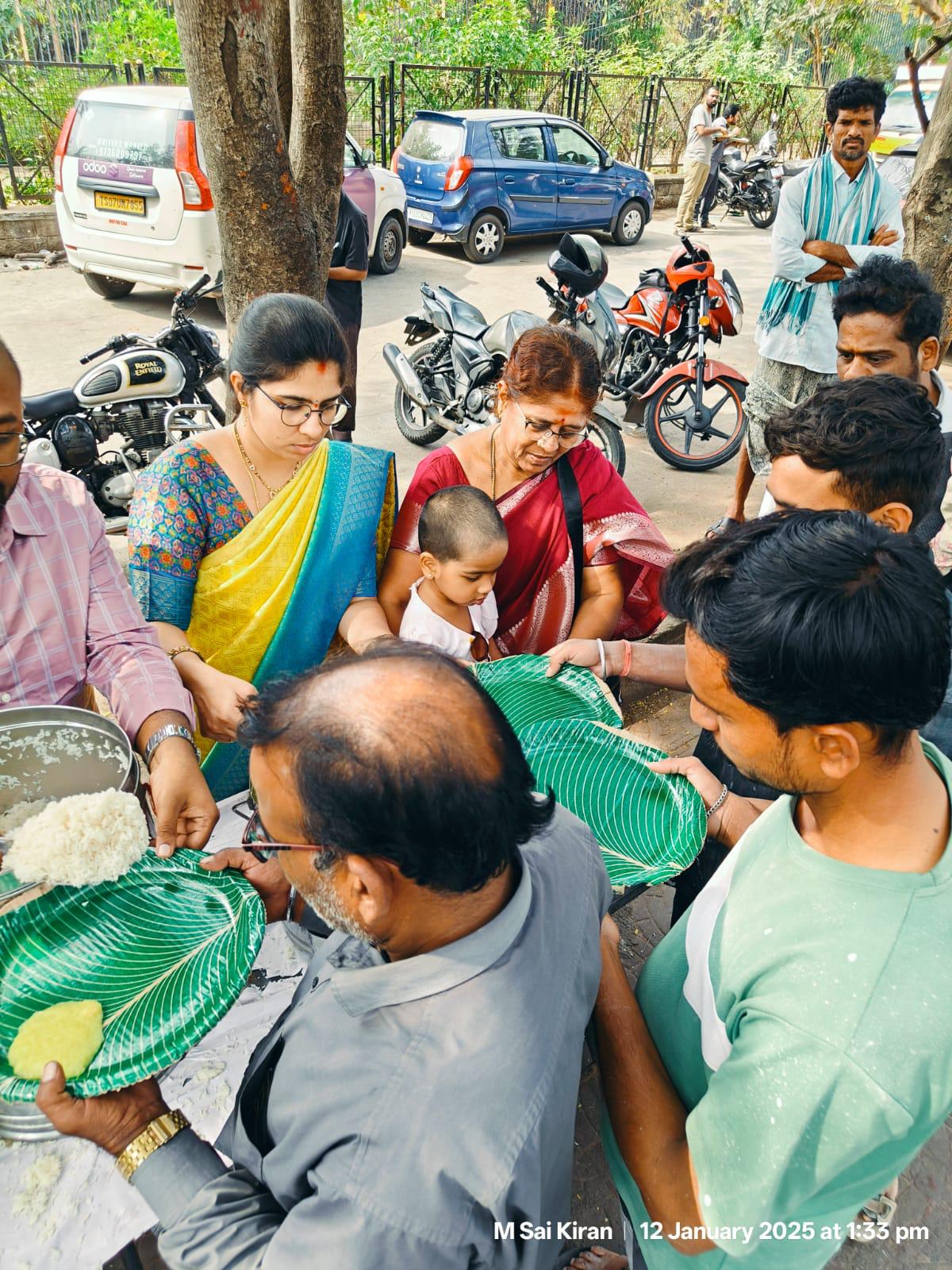 Volunteers and children at a Share A Smile community program